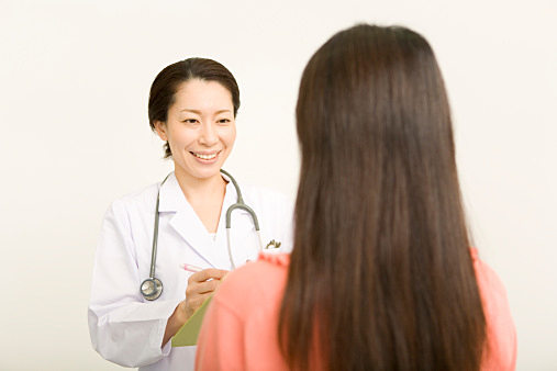 Female doctor talking to patient