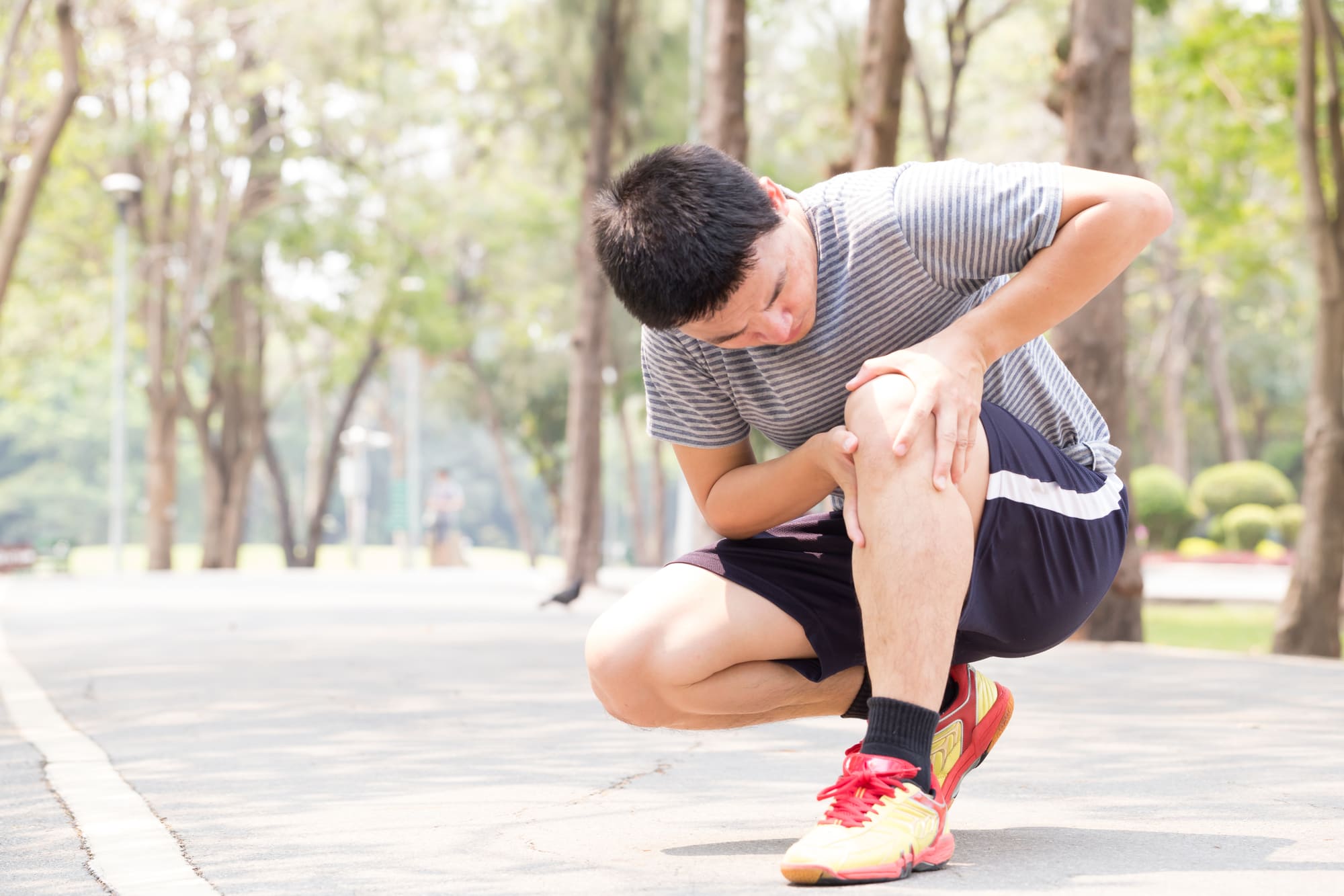 Man having knee pain while exercising